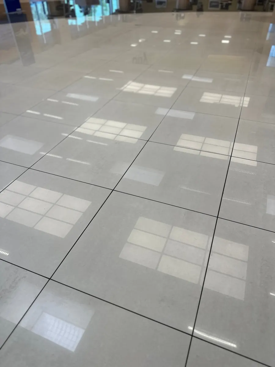 Glossy porcelain tile floor in a commercial space after a commercial cleaning by AD Cleaning Orlando