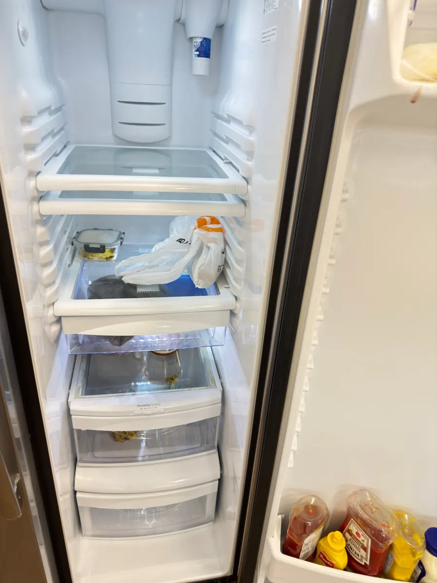 After: refrigerator with clean shelves and drawers after cleaning by AD Cleaning Orlando